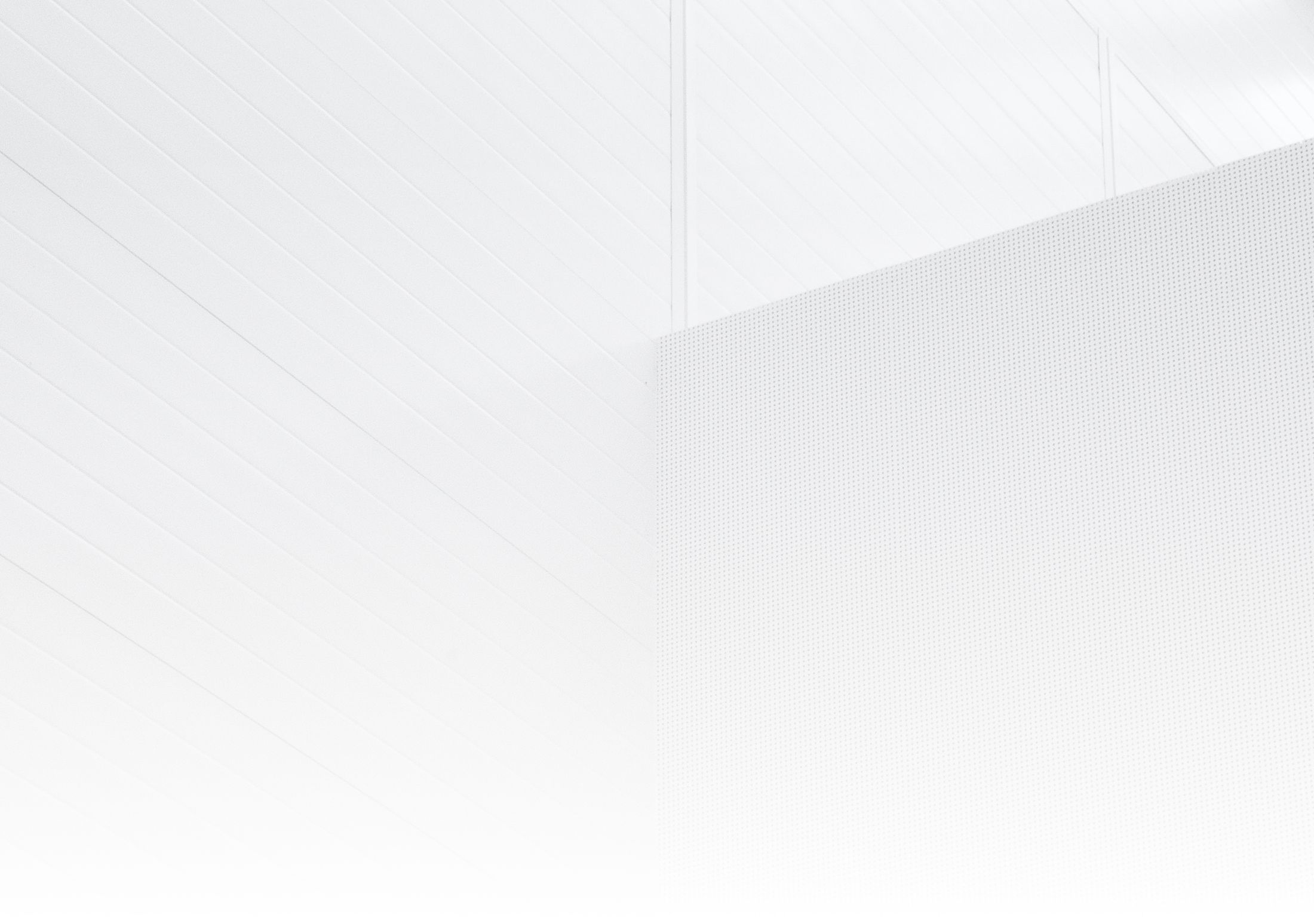 Abstract white geometric wall design.