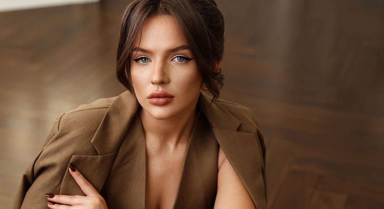 Model with closed eyes and soft, tousled hair.