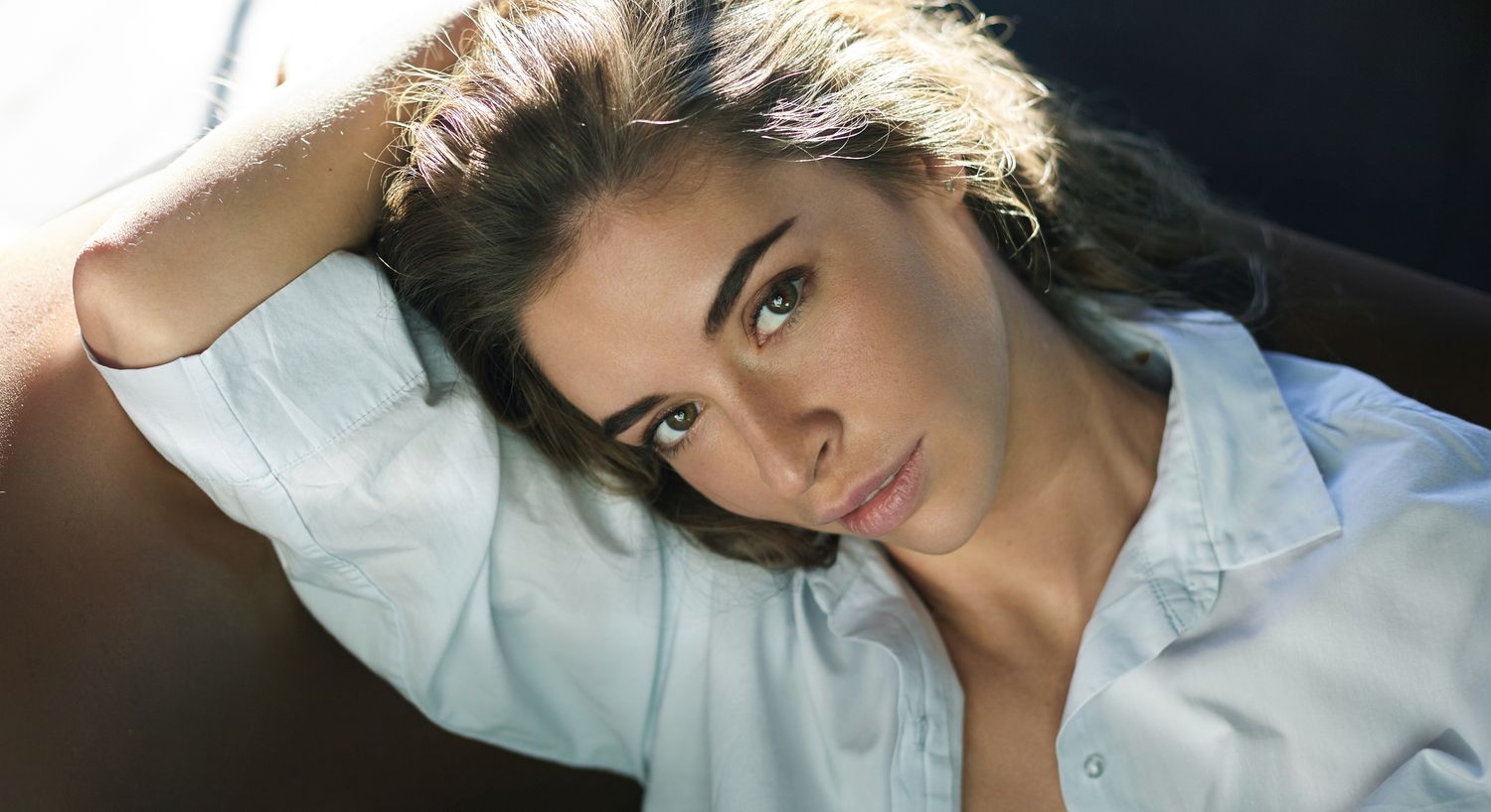 Portrait of a woman with long dark hair.